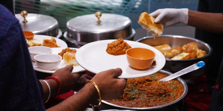 Steward Serving to the Guests